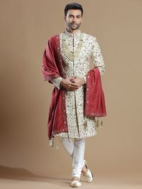 Make classic and subtle you are touching up your attire this season perfect for wedding ceremonies! Get your hands on this cream raw silk premium sherwani for groom wear. All over embellished with resham, zardosi, zari, sequins, beads work. It features a stand collar, a full button placket, full sleeves, and a straight vented hem.