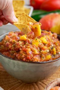 Looking for a spicy mango habanero salsa recipe? This one is full of roasted vegetables and fresh habanero peppers and mangos! This spicy homemade salsa is perfect for dipping chips, on nachos or tacos. It has all fresh roasted vegetables and fruit!