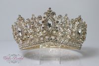 "FAST SHIPPING Beautiful sparkling crystal tiara plated gold. Perfect for your Quinceañera, Wedding, First Communion or Confirmation. It has a loop at the end of each side to attach it in your hair with bobby pins for added security. Approx. 3.75\" tall at its tallest point We usually ship within 1-2 business days. Style-RN205G"