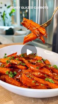 Olivia Adriance ♡ on Instagram: "HONEY GLAZED CARROTS✨ a simple, healthy, and delicious holiday side that needs to grace your table! I’ve always been the one at family holidays in charge of the healthy side dishes and I would’t have it any other way. This recipe comes together one sheet pan so we’re talking minimal dishes ladies and gents. Raise your hand if you’re usually on holiday dish duty (looking at you @kyle.adriance 🙋🏼) Ingredients: 2 lbs carrots, peeled and cut to 1.5” in length and 1/2” thickness 3 tbsp olive oil 1/4 cup honey 2 large cloves garlic, minced 1 tsp smoked paprika 1 tsp cinnamon 1/2 tsp cumin 1 tsp salt 1/4 tsp pepper Directions: Preheat your oven to 425 In a small jar, whisk together your honey, olive oil, spices, garlic salt and pepper Add your carrots