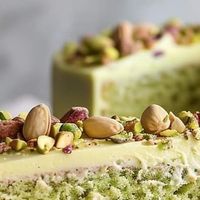 Chef Marcelo Mintz on Instagram: "Elegant White Chocolate Pistachio Cake
Ingredients:
1 1/2 cups all-purpose flour
1 cup shelled pistachios, finely ground
1 teaspoon baking powder
1/2 teaspoon baking soda
1/4 teaspoon salt
1/2 cup unsalted butter, softened
1 cup granulated sugar
2 large eggs
1 teaspoon vanilla extract
1/2 cup buttermilk
1/2 cup sour cream
1/2 cup white chocolate chips
For the Frosting:
1 cup unsalted butter, softened
4 cups powdered sugar
1/2 cup white chocolate, melted and cooled
1/4 cup heavy cream
1/4 cup pistachio puree
1 teaspoon vanilla extract
Chopped pistachios for garnish
Directions:
Preheat your oven to 350°F (175°C). Grease and flour three 8-inch round cake pans.
In a medium bowl, whisk together the flour, ground pistachios, baking powder, baking soda, and salt.