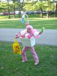 Costume : styrofoam cooler cut out to fit on waist for the bathtub, big candy cane covered in foil with a cup on the end for the showerhead, blue paper for water, balloons for bubbles, a bubble bath bottle, rubber ducky, and shower cap on your head..SUPER cute and super easy!