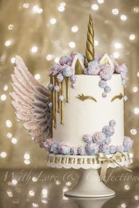 Unicorn Drip Cake with Meringue Wings - Cake by Veronica Arthur of With Love & Confection. My version of the ever so popular Unicorn cake with meringue kisses and MERINGUE WINGS! White chocolate drip painted in gold luster. Cake is 4 layers of unicorn swirl and iced in buttercream. BTW- I made this cake just for fun but it sold the next day after I posted it on facebook ;)