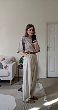 Oversized T-shirt outfit idea | Boxy, oversized T-shirt, loose linen trousers and fisherman sandals. Click for full outfit details.