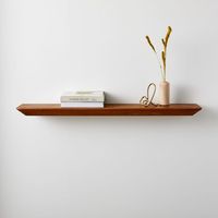 Our streamlined Slim Floating Shelf can serve as a display for your favorite photos or cherished knickknacks, or even as a small landing pad for your on-the-go essentials like keys and sunglasses. KEY DETAILS Solid and engineered wood. Hanging hardware included. Sold individually. Made in China.