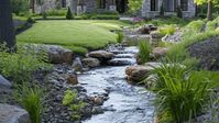 Discover 22 innovative and captivating backyard stream ideas to transform your outdoor space into a serene oasis.