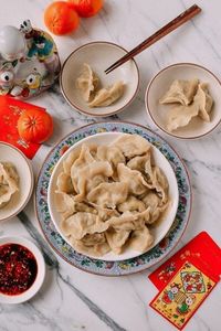 This recipe for pork and fish dumplings Jiaozi comes from the Northern provinces of China, where dumplings are the star of every family’s Chinese New Year’s Eve celebration. The mix of pork and fish is a wonderfully savory combination, with a mild flavor and texture that makes these dumplings pillowy soft inside.