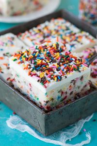 Homemade funfetti sheet cake recipe that bakes in 40 minutes! Makes a 9x13 inch cake that has amazing flavor and is loaded with sprinkles!!