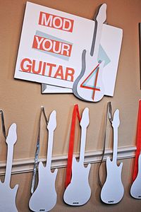 design your own guitar- station. Creative idea to keep kids occupied at wedding. then they can rock out on the dance floor later.