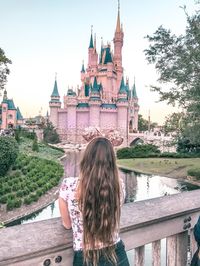 enjoying the view of cinderella castle in magic kingdom at disney world