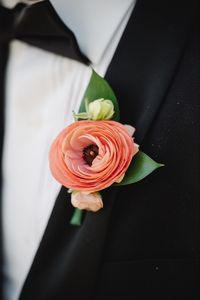 Clean and simple ranunculus boutonniere | Photo by Asya Photography