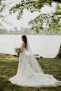 Bride in Strapless Lace Gown with Long Veil and Chapel Train | Hannah Ellis Bridal Portrait at The Estate At Cherokee Dock