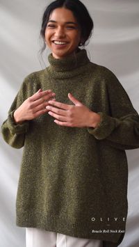 Our classic boucle knit jumper, with a roll neck and made from a 60% wool mix; perfect for layering in the chillier months. Features a flecked detail to the knit, an unbalanced hemline, dropped shoulder sleeves and a small Olive tab stitched to one side of the seam. The boucle is boxy in cut and is made for a relaxed and slouchy fit.