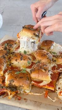 Tieghan Gerard on Instagram: "Pull Apart Roasted Garlic Pizza Dip Sliders. Garlic bread, pizza dip, and sliders all in one. The garlic butter on top makes them extra special and freaking delicious. Always everyone’s favorite. 1 head garlic extra virgin olive oil 1 (12-count) package dinner rolls, halved lengthwise 1 – 1 1/2 cups marinara sauce 3/4 cup shredded mozzarella cheese 3/4 cup shredded provolone cheese 1/4 cup grated parmesan cheese 1/2 cup thinly sliced pepperoni 3 tablespoons salted