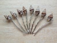 SAVE ON MULTIPLES!! Buy four get one FREE NINETEEN shell hair pins are made and READY TO SHIP, shells in stock to make more! This pretty shell hair pin would be a perfect addition for a beach wedding, summer vacation, mermaid costume or for everyday fun. They would be a great item for a summer beach/pool birthday party favor! The sweet little shells look like tiny conch shells and have stripes of white and brown.  The shells are securely attached to a silver metal hair pin that is two inches in