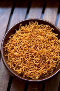 aloo sev recipe with step by step photos – crisp sev made with potatoes and gram flour (besan). #aloosev #sev #potatoes #teatimesnacks