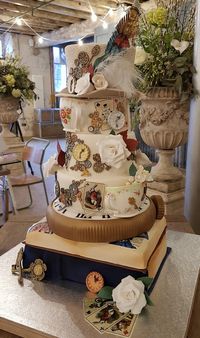 Mad hatter meets cogs and keys wedding cake