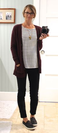 plum cardigan, striped shirt, black skinny jeans, black quilted slip-ons