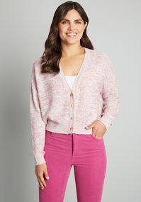 Sweetness makes the world go round in this precious pink cardigan.