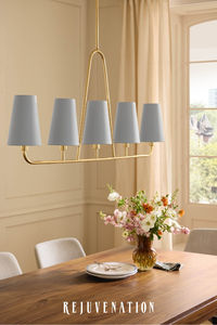 The linear Ansel Chandelier offers both function and fashion for your dining needs.