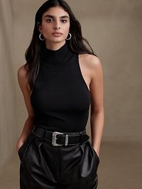 The ultimate layering piece, don this fitted tank when the season calls for a touch of sophistication.  It looks incredible under blazers and high-waisted trousers.  FITTED: Stretches to fit.  Halter mock-neck.  Straight hem.  #509230 Fitted.  Sleeve