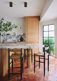 Spanish revival kitchen with rounded kitchen island