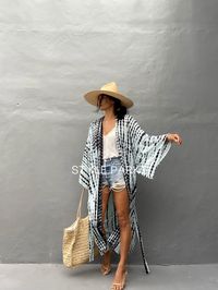 Bali Tie dyed Kimono long jacket,  It's made by the Bali's traditional  Tie dyed  Perfect for a swimsuit cover up on the beach or by the pool , with shorts and a tank top or over a summer dress. At home wear  If you are very small this may be too big.  👗Stylepark1 Model  -Her height is 175Cm/5.74ft weight is 64kg/141.09Ib /American size, she wore  ~ M to large size.  Made from soft Rayon   🙏🏻 At first, you may smell of the unique dye. It will disappear after you wash it. So do not worry. 👗co