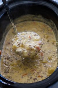 All of the flavors of your favorite cheeseburgers, but in a fantastic crockpot soup, this Slow Cooker Cheeseburger Soup is filled with ground beef, lots of veggies all in a creamy, cheesy soup.