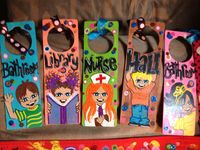 I painted these plain wooden door hangers to be used as hall passes!