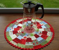 Here's the tutorial I promised on how to make a scrappy string ring table mat. It's easy and fun! Basically, you will be making a Dresd...