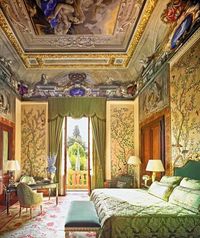 Bedroom with astounding painted ceiling.