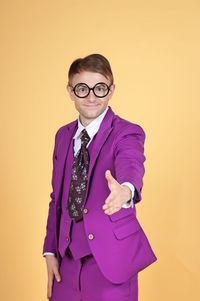 Nerd businessman in purple suit shaking hands