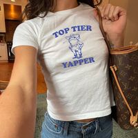 Description: Top Tier Yapper Baby Tee, Meme T Shirt, Baby Tee Y2K, Retro Frog Baby Tee T-Shirt, Funny Baby Tee, Graphic Baby Tee For Women Midweight Comfort 🌿:  With a fabric weight of 5.3 oz/yd² (180 g/m our women's baby tees strike the perfect balance between lightweight breathability and cozy warmth, making them suitable for any season (100% cotton) Ethically Produced 🌍:  Our commitment to ethical fashion shines in our women's baby tee collection, made from ethically grown and harvested US