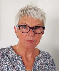 Spiky short haircut for women over 60 with glasses