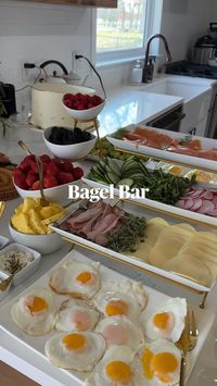 Indulge in the perfect brunch experience with a picturesque spread featuring a bagel bar, fresh fruit, delectable cakes, charming decor, and a refreshing touch of orange juice. Explore this delightful snapshot that captures the essence of a brunch gathering filled with delicious treats and vibrant ambiance. Elevate your brunch inspiration on Pinterest!