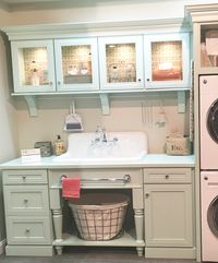 Fun tour of MasterBrand Cabinet showroom today in Jasper, IN. Love this creative laundry room concept, with glass front lighted storage in soothing pastels. The chore wouldn't be so bad in this space!