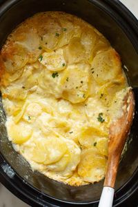 Easy, creamy scalloped potatoes from scratch with simple ingredients. Cook this potato casserole slowly in the crock pot until, creamy, tender, golden, and bubbly. Potato perfection! #alyonascooking easyrecipe #scallopedpotatoes #potatorecipe #creamypotatoes #sidedish #easysidedish #festiveside #Thanksgiving #noroux #casserole #crockpot