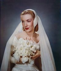 white feather covered headpiece and flowing veil. #vintage #bride #wedding #dress #bouquet #1940s #hair