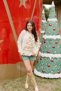 Style your holidays in this white Merry Tinsel Christmas Sweater! Its oversize fit and stretchy material make it a comfy and festive choice perfect for spreading good cheer. Add a bit of sparkle and holiday magic to your wardrobe this year! also available in red model, Halie is wearing a size small