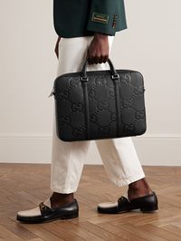 Gucci's designs are anything but corporate, though this all-black briefcase will certainly get a pass in the boardroom. Made in Italy from monogrammed leather, it has a sleeve to stow your laptop and plenty of compartments to keep business cards organised and separate from your personal belongings.