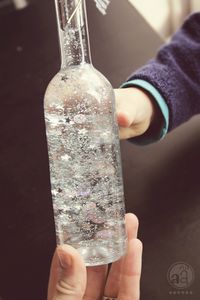 DIY Magic bottles—fill with distilled water, glycerin drops, glitter flakes, sequins, light plastic beads - anything that sparkles and is light enough to float around. Maybe with glow in the dark slime?