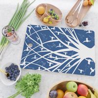 Birds on tree branches. artistic, tree, birds, blue, white, blue-white, indigo, navy, deep-blue. Cutting Board