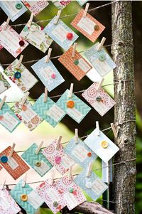 Cute as button escort cards. Love the different colors of the paper