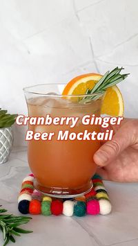 This refreshing cranberry ginger beer mocktail blends tangy cranberry and zesty orange juices, topped with spicy ginger beer. A vibrant non-alcoholic delight.