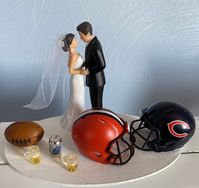 House Divided RIVALRY Bride Groom Cake Topper Bridal Funny Humorous Wedding Day Reception NFL Team Football Themed Beer 2 mugs Grooms cake This 4 1/2 high x  1.7 inches Elegant plastic cake topper with a Your picked football teams helmet and football and beer can and 2 mugs added to the item USE THE PULL DOWN TABS TO PICK YOUR 2 TEAMS  THIS IS FREE WITH THE PURCHASE HAIR COLOR CAN BE CHANGED FOR BOTH BRIDE AND GROOM PLEASE ADD WHICH COLOR YOU NEED FOR WHICH FIGURE IN THE NOTE SECTION OF PAYMENT