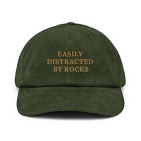 🎉 "Easily Distracted by Rocks" Embroidered Corduroy Hat 🪨✨ A hat made of corduroy? That's a yes! Our "Easily Distracted by Rocks" embroidered corduroy hat is the ultimate accessory for geology enthusiasts, nature lovers, and anyone who can't resist the allure of a cool rock. Whether you're a student, a seasoned geologist, or just love exploring the great outdoors, this hat is a fun and stylish way to show off your passion. Key Features: 🪨 100% Cotton Corduroy: Enjoy the softness, durability,