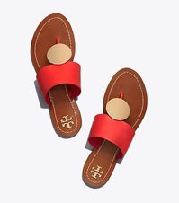 The Tory Burch Patos Sandal flatters the foot in soft calfskin with a hit of gold hardware: a reflective metal disk at the toe post. It has limitless styling potential and is comfortable enough for all-day wear. Tory Burch Patos Disk Orange Sandal. #ToryBurch