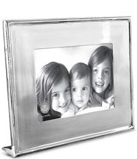 From  Beatriz Ball, this frame features:A stunning statement. The Jason silver frame of polished metal enhances your favorite 5x7 horizontal photo, and looks brilliant when displayed on the mantle, desk, or shelf. The footed, self-standing frame makes a fine wedding gift--or for any special occasion--and is an elegant solution whenever a silver frame is called for. FeaturesMade of a top quality aluminu