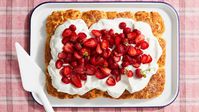 In this strawberry shortcake that feeds a crowd, a tender biscuit cushions a cloud of lightly sweetened cream and a tumble of juiced-up berries. Peaches, plums, or nectarines can be swapped in for the strawberries if you prefer.