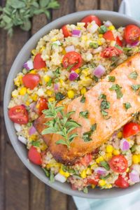 This Honey Garlic Salmon Quinoa Bowl is a flavorful and delicious, protein-packed meal. It's filled with hearty quinoa, fresh corn, cherry tomatoes, and herbs. Tossed in a simple, white balsamic dressing and served with salmon seasoned with a honey garlic sauce, this easy dish is ready in just 30 minutes and full of flavor!